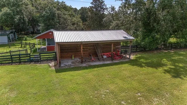 a aerial view of a house with a yard