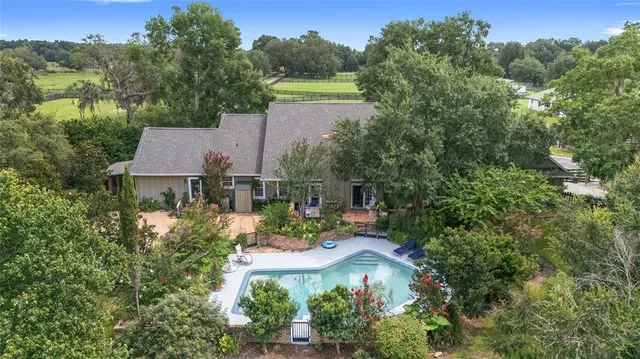 an aerial view of a house with a garden