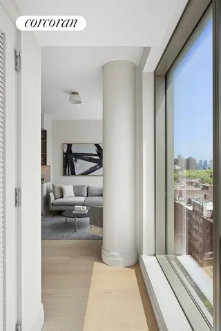 a living room with a table and chair