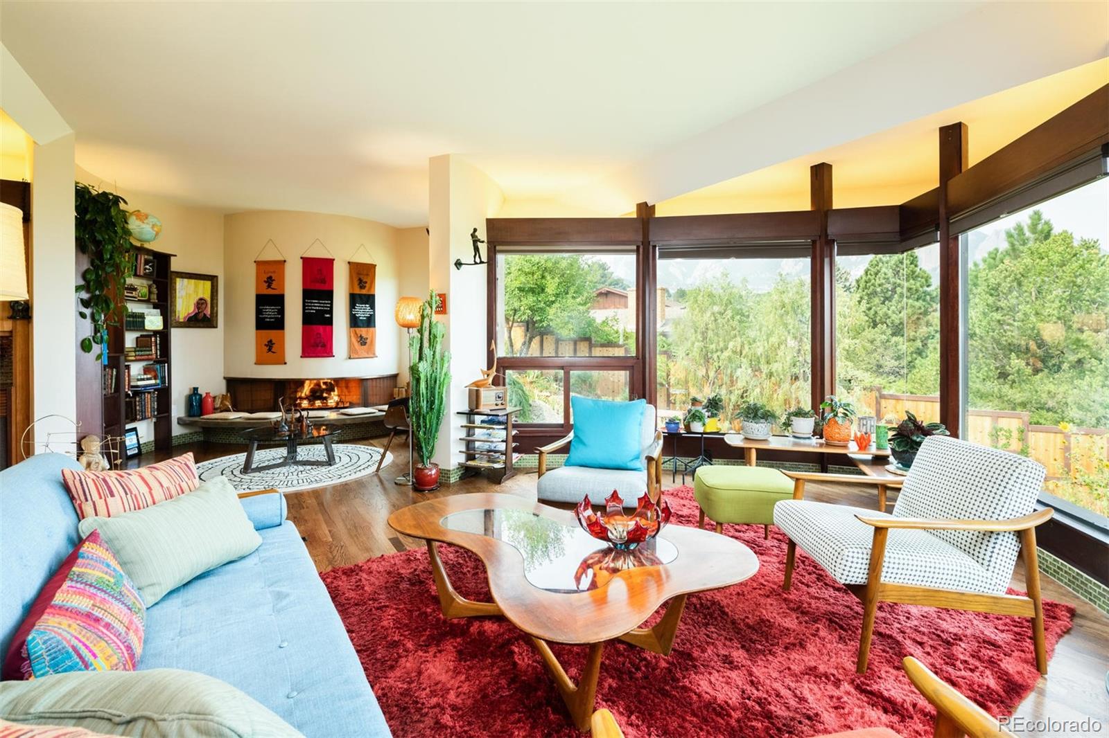 415 Drake Street Boulder, CO 80305 - Photo 11 of 40 a living room with furniture and floor to ceiling windows