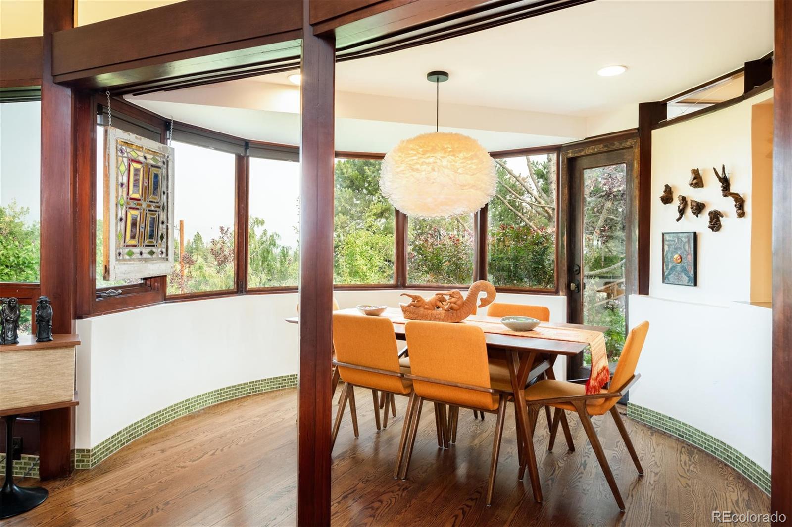 415 Drake Street Boulder, CO 80305 - Photo 16 of 40 a dining room with furniture a chandelier and wooden floor