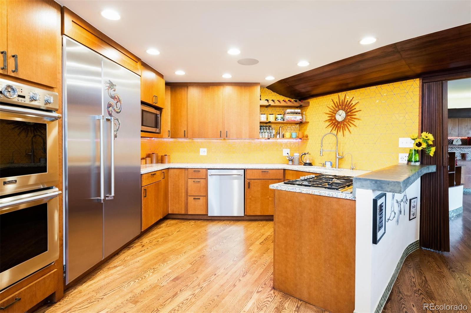 415 Drake Street Boulder, CO 80305 - Photo 19 of 40 a kitchen with stainless steel appliances granite countertop a stove a refrigerator and a sink