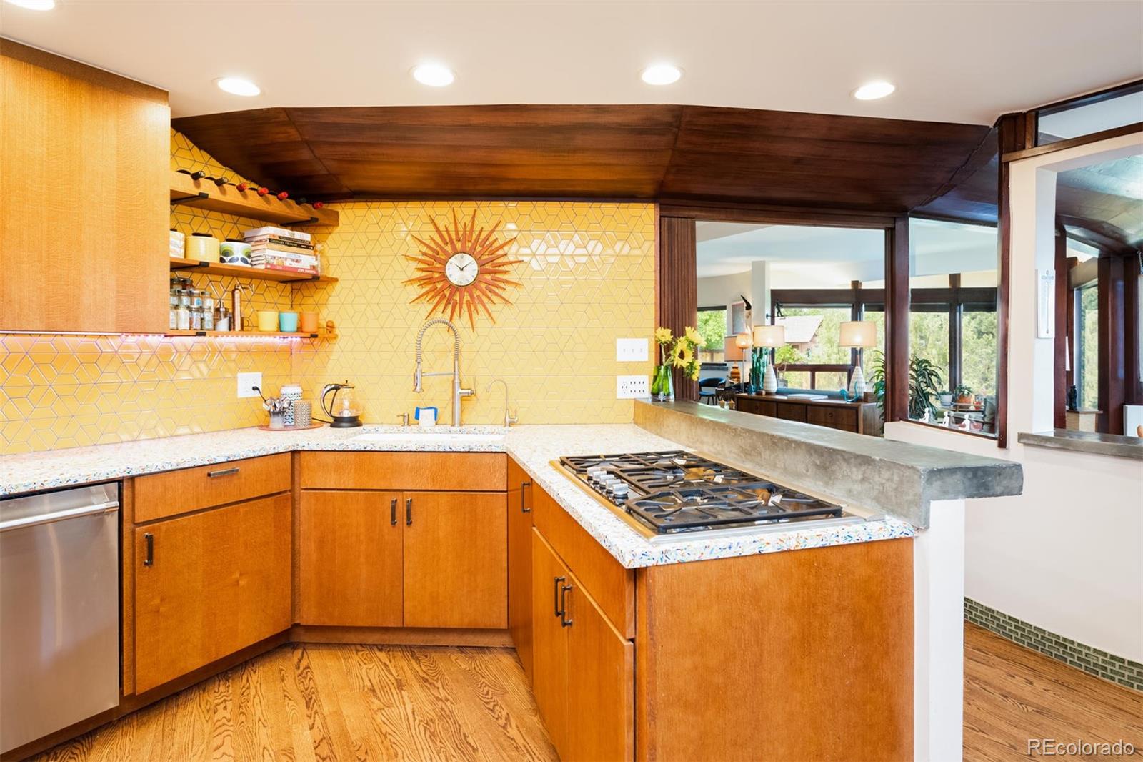 415 Drake Street Boulder, CO 80305 - Photo 20 of 40 a kitchen with stainless steel appliances granite countertop a sink stove and cabinets