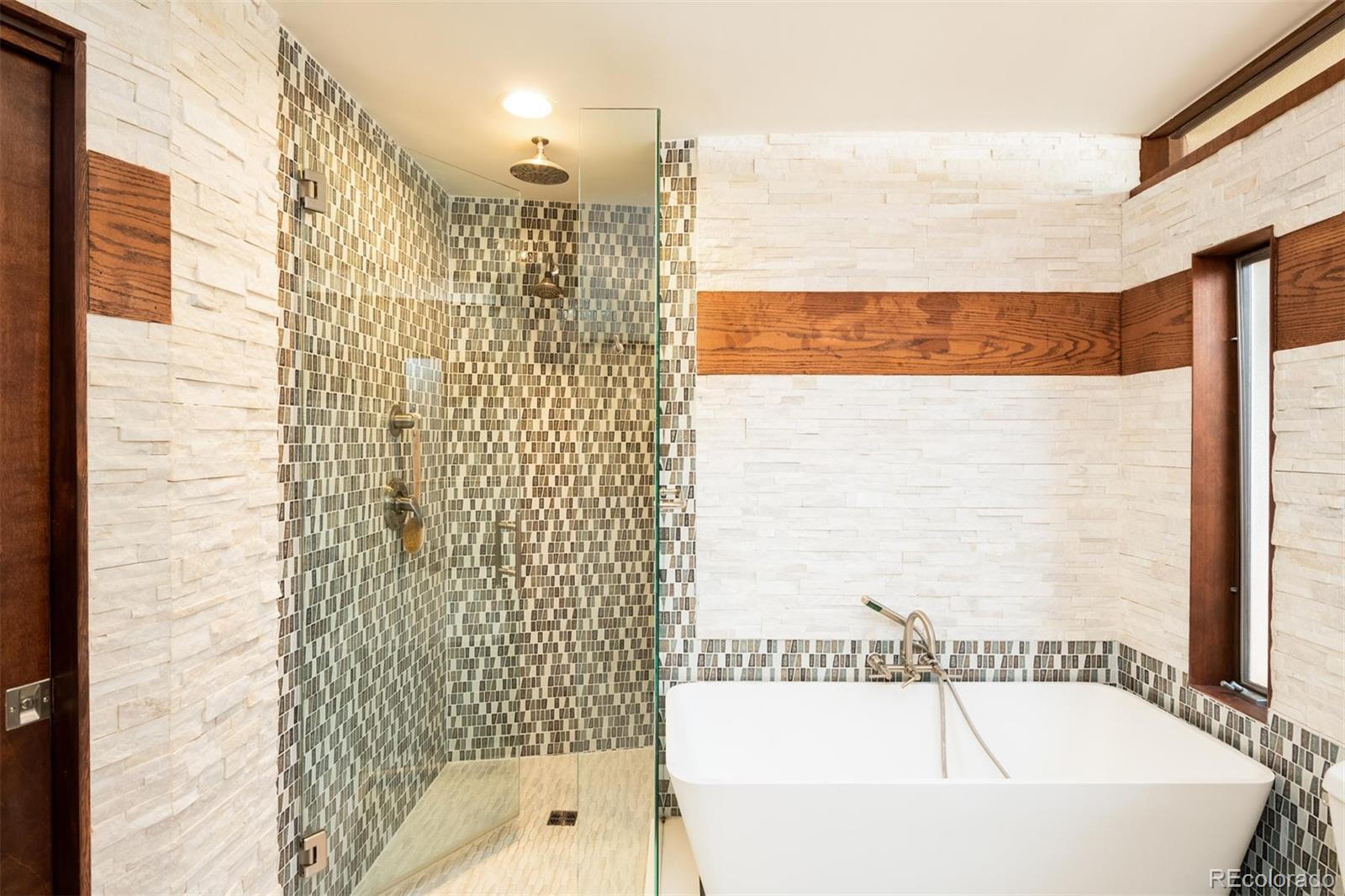 415 Drake Street Boulder, CO 80305 - Photo 25 of 40 a bathroom with a bathtub and shower