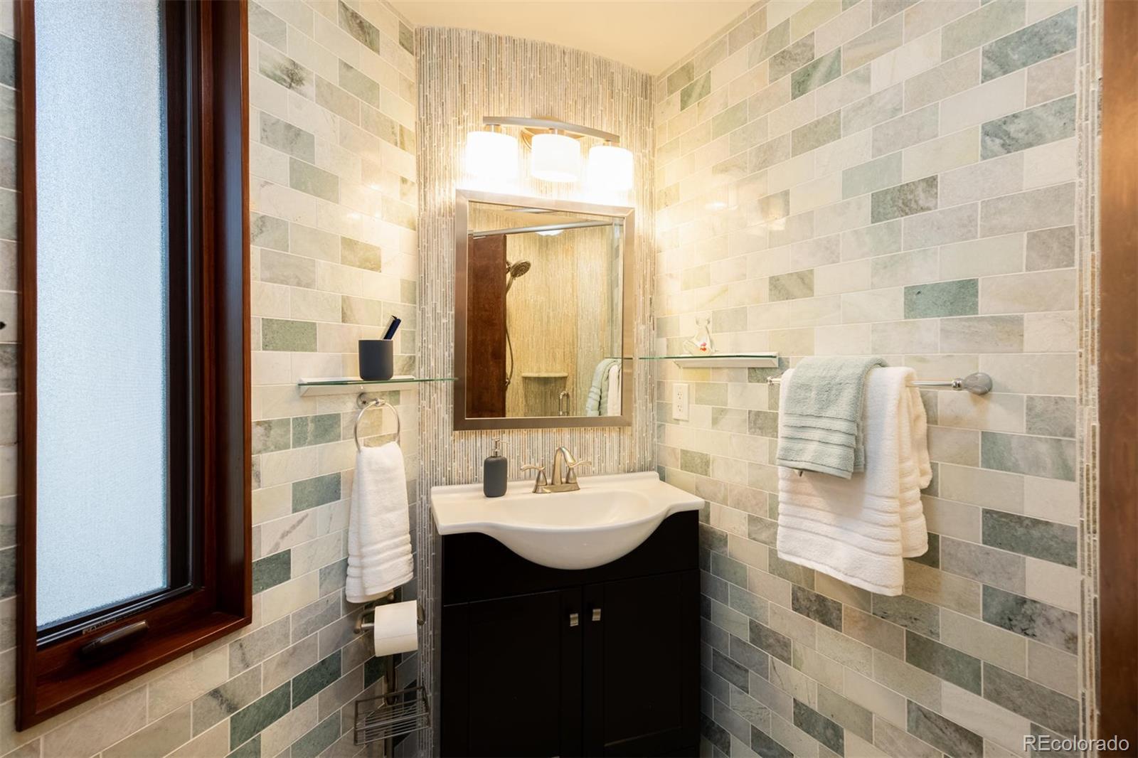 415 Drake Street Boulder, CO 80305 - Photo 29 of 40 a bathroom with a sink and a mirror