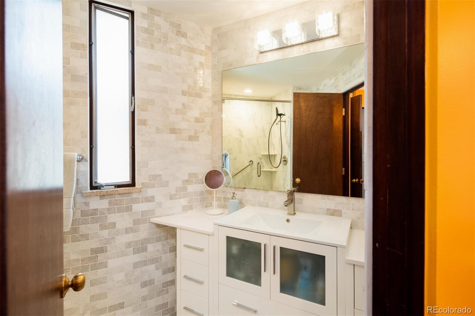 415 Drake Street Boulder, CO 80305 - Photo 34 of 40 a bathroom with a sink and a mirror