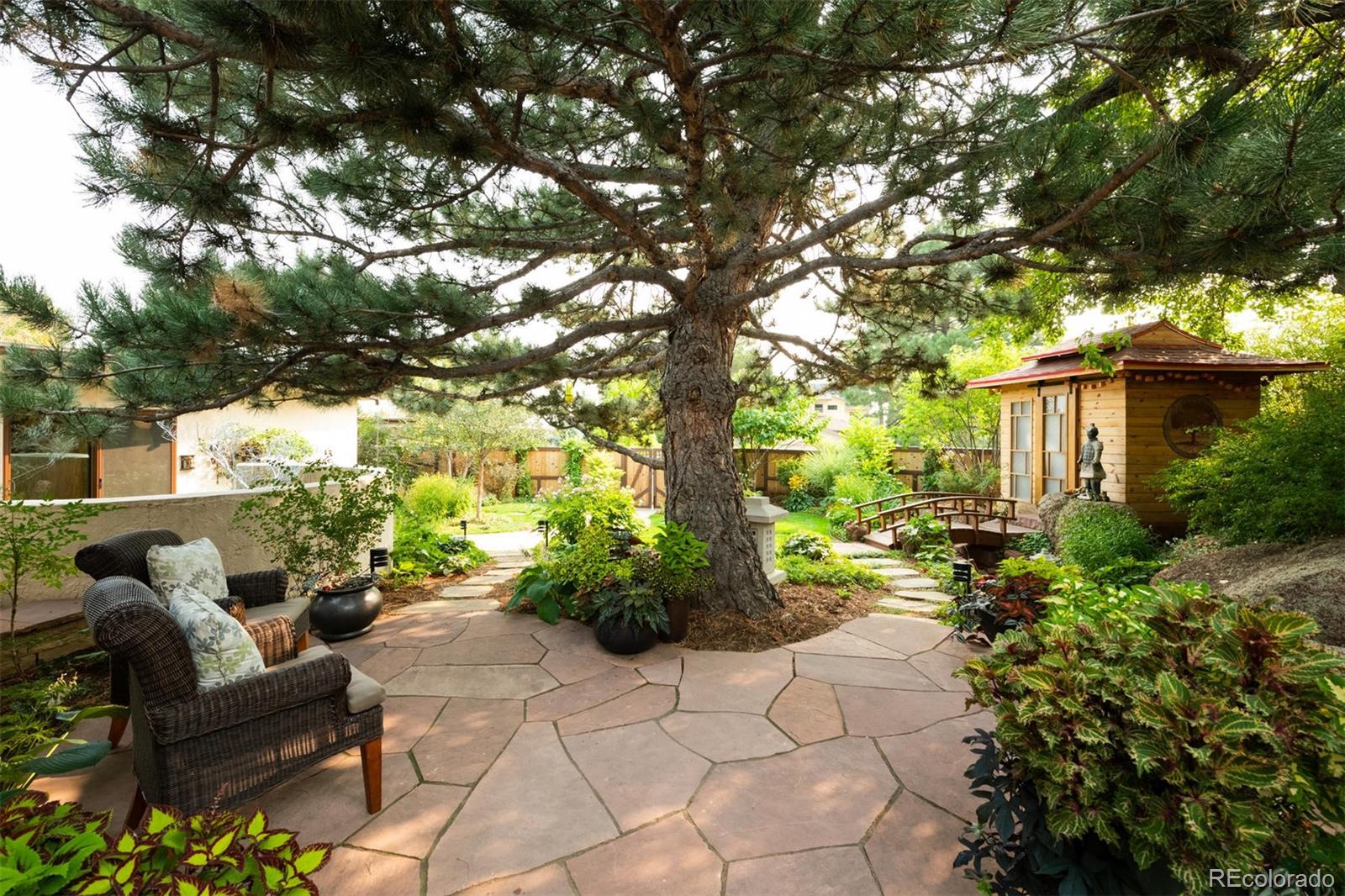 415 Drake Street Boulder, CO 80305 - Photo 4 of 40 a view of a chairs and table in a backyard