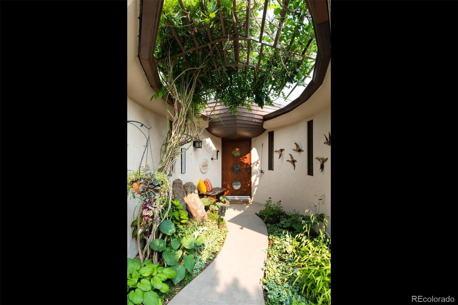 415 Drake Street Boulder, CO 80305 - Photo 5 of 40 a front view of a house with a yard