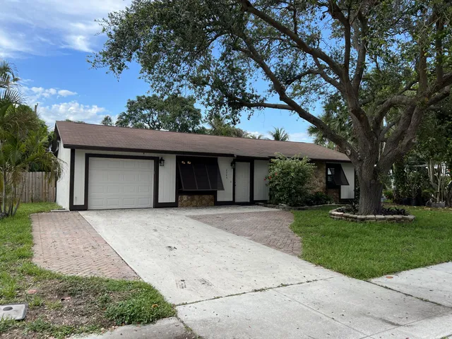 front view of a house with a garden
