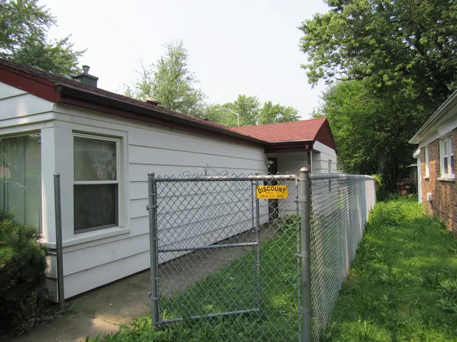 a view of a wooden fence