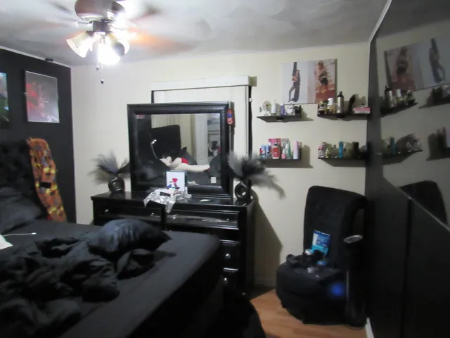 a living room with furniture and a mirror