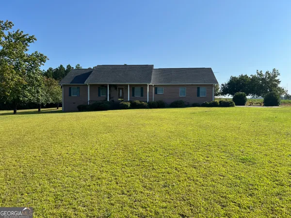 a front view of a house with yard