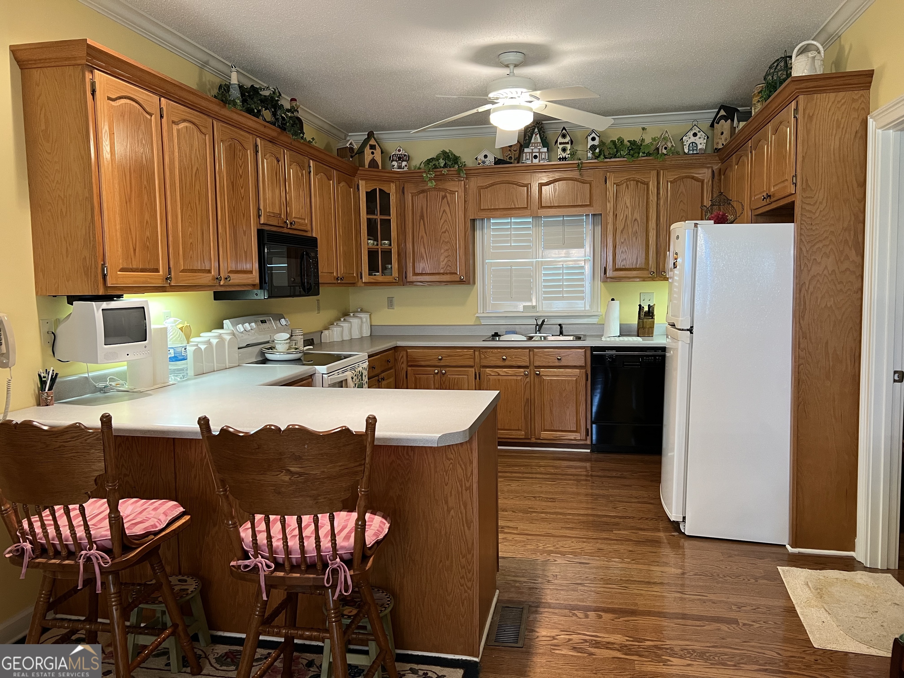 762 Nicholson-Carr Road Chester, GA 31012 - Photo 11 of 80 a kitchen with stainless steel appliances granite countertop a sink refrigerator and cabinets