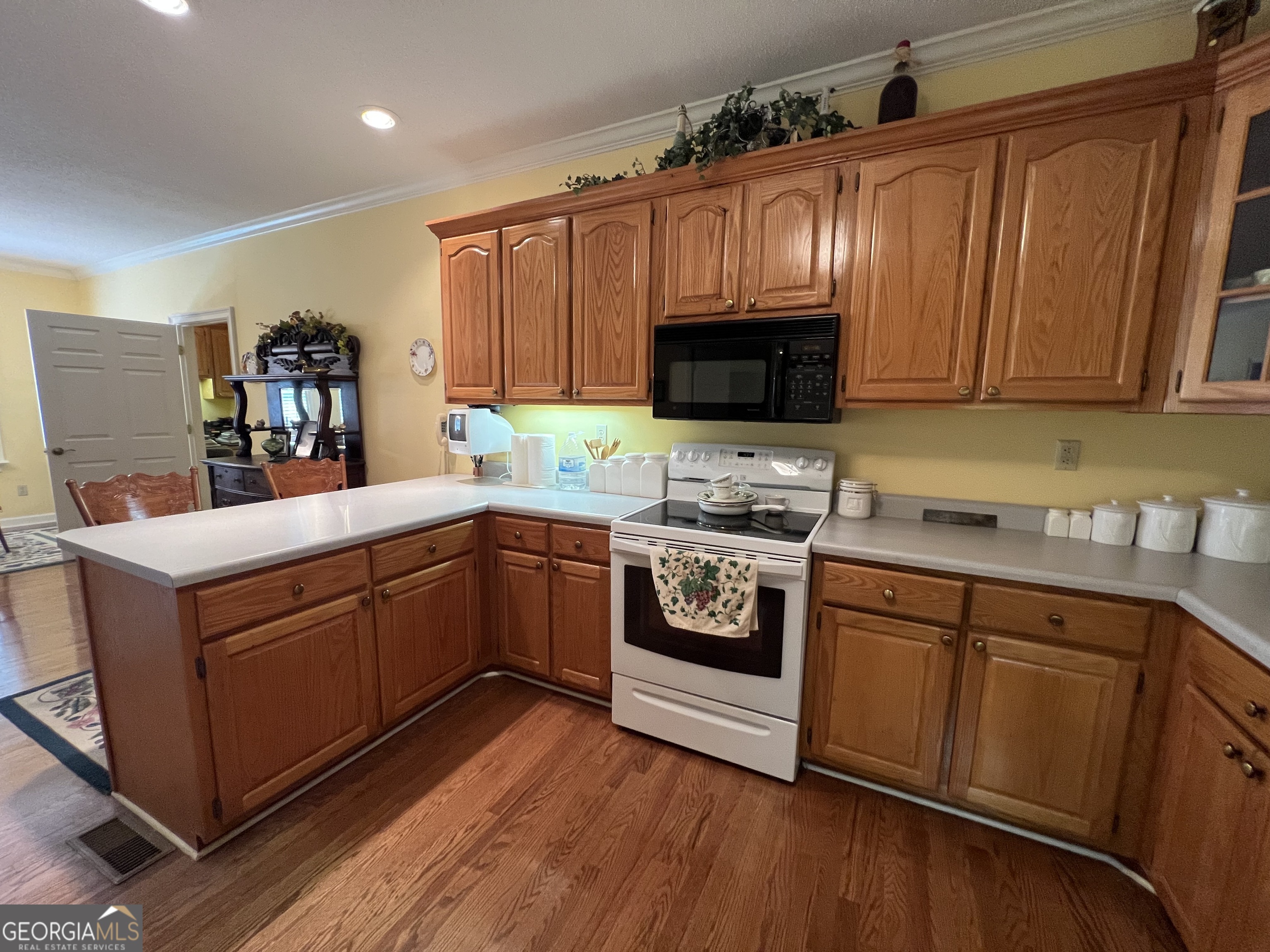 762 Nicholson-Carr Road Chester, GA 31012 - Photo 13 of 80 a kitchen with stainless steel appliances a stove top oven a sink and a microwave