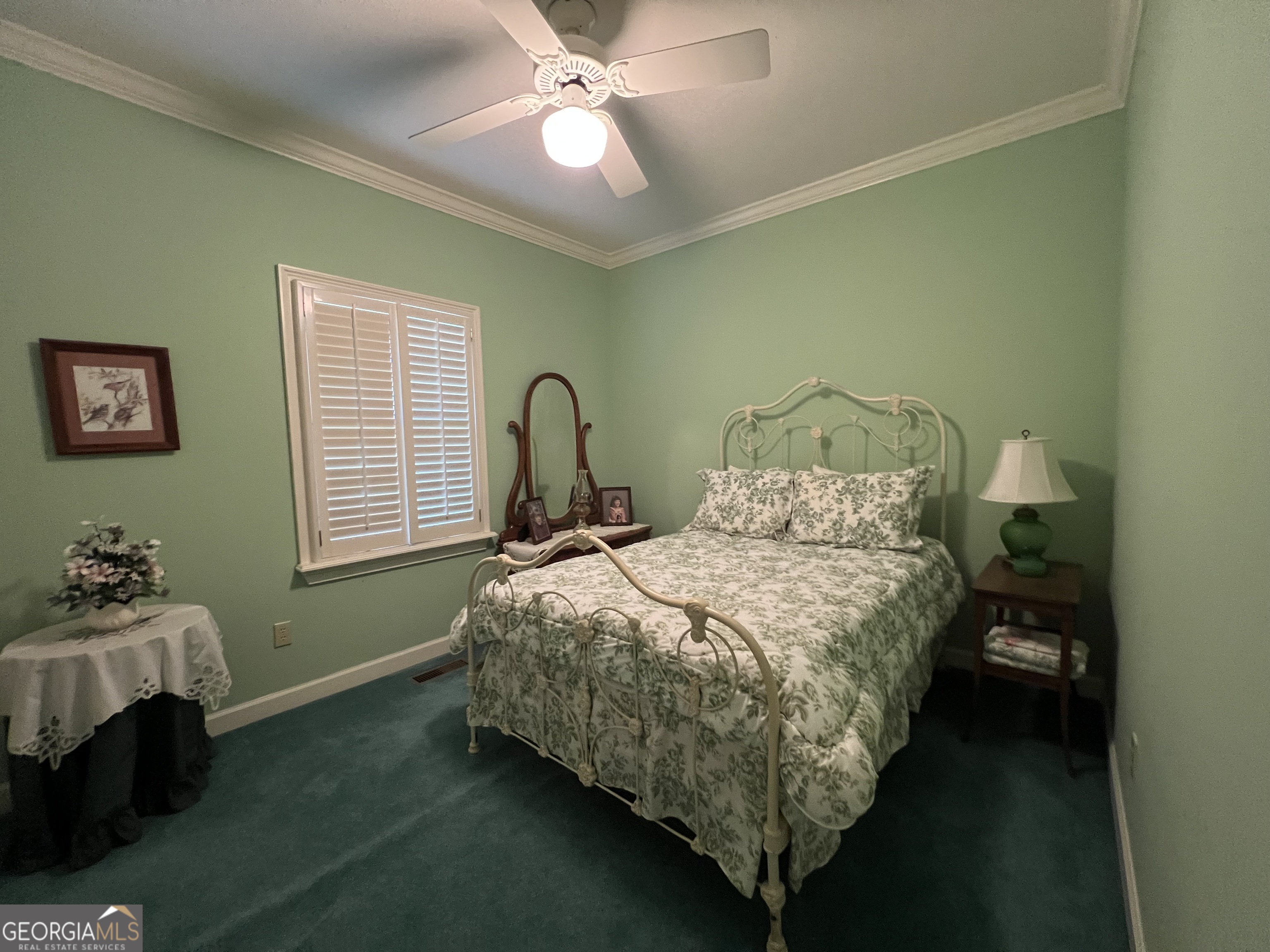 762 Nicholson-Carr Road Chester, GA 31012 - Photo 24 of 80 a bedroom with a bed and a chandelier