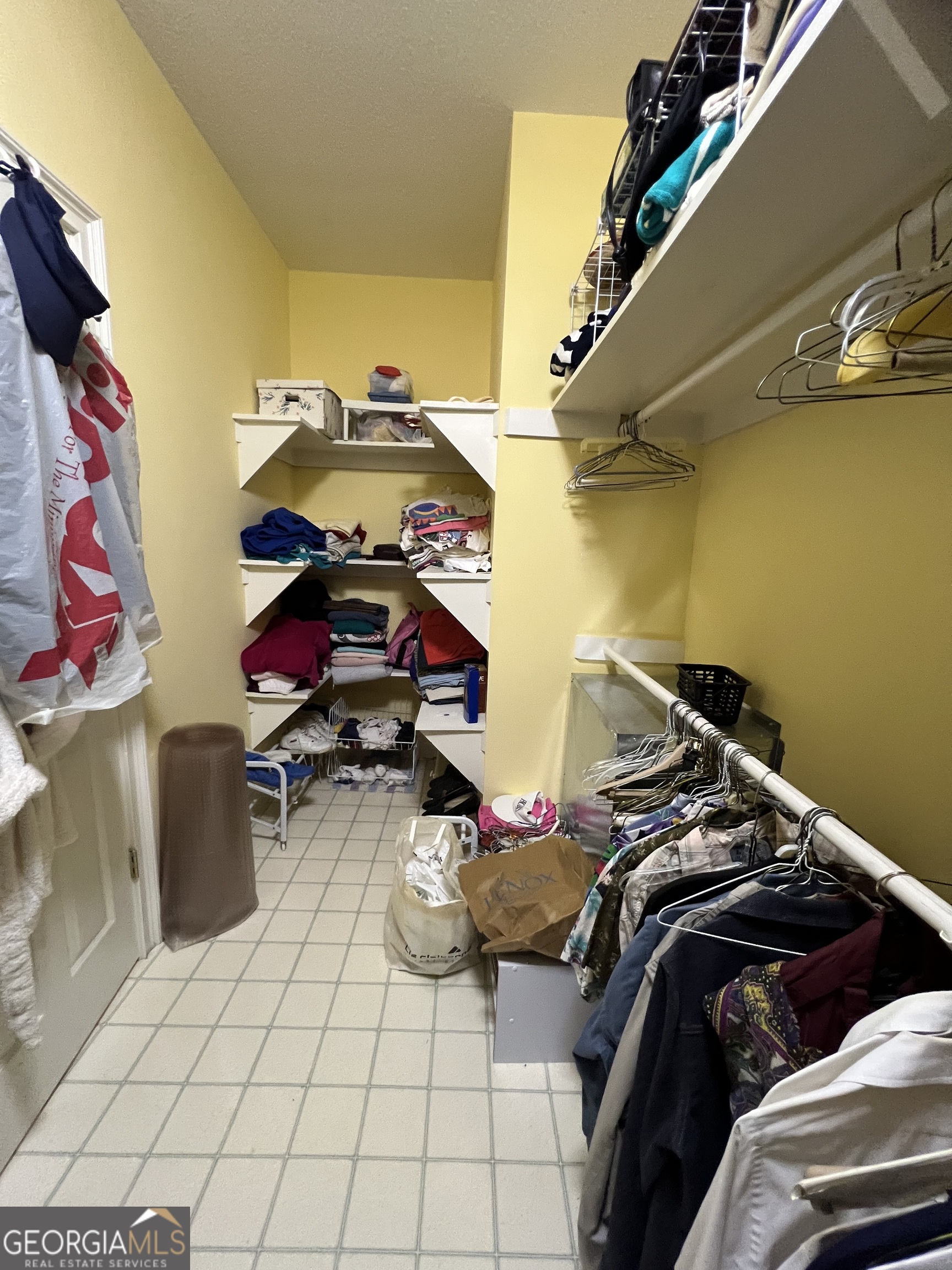 762 Nicholson-Carr Road Chester, GA 31012 - Photo 32 of 80 a view of walk in closet with clothes and shoes