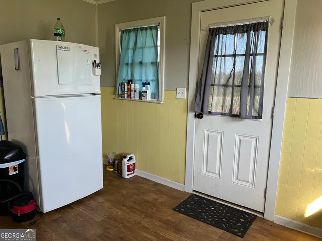 a view of a swimming pool and trees in the background