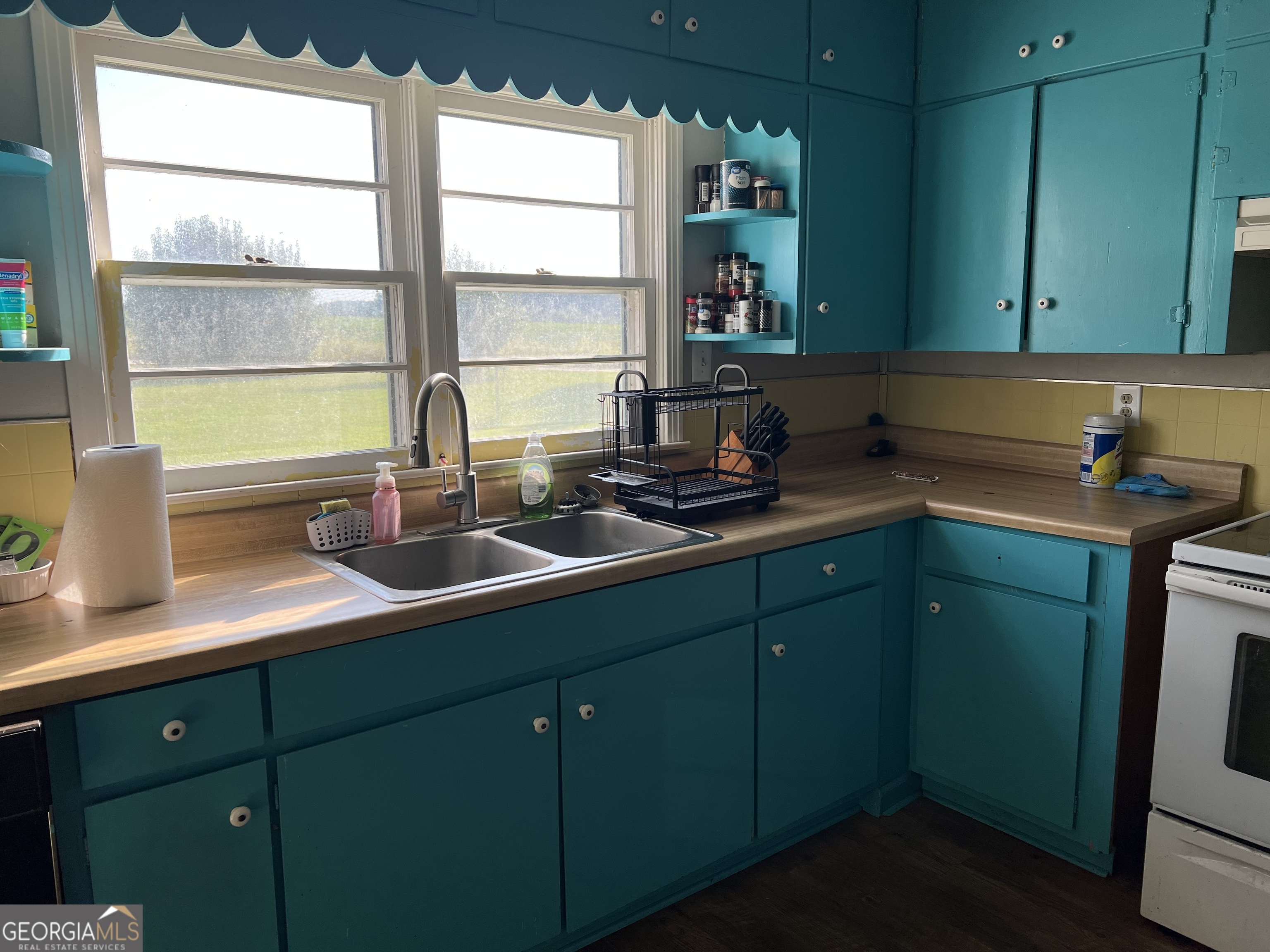 762 Nicholson-Carr Road Chester, GA 31012 - Photo 39 of 80 a kitchen with a sink and a window