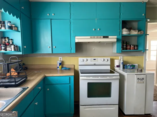 a view of a lake with houses in the background
