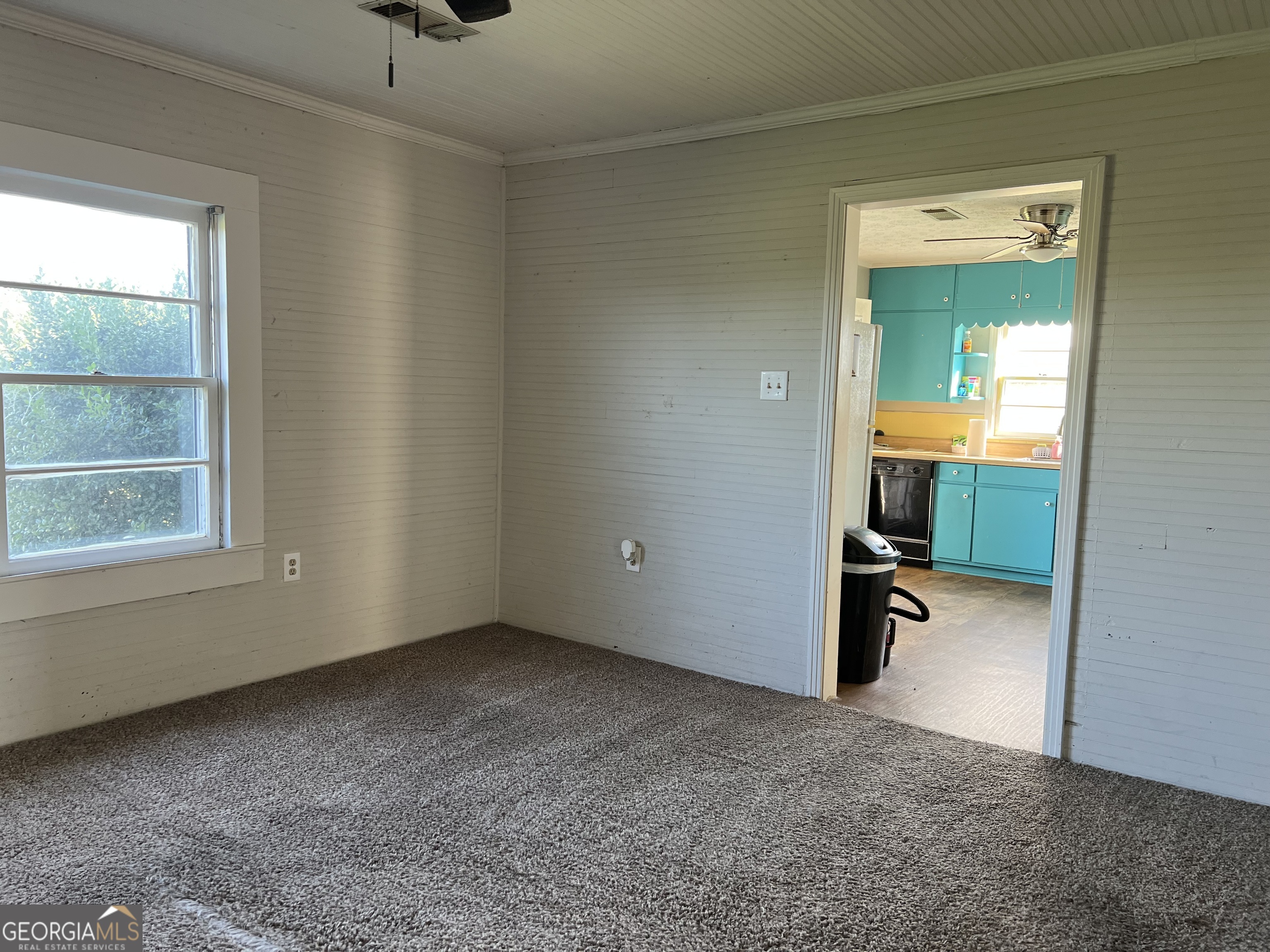 762 Nicholson-Carr Road Chester, GA 31012 - Photo 42 of 80 an empty room with a fireplace and a window