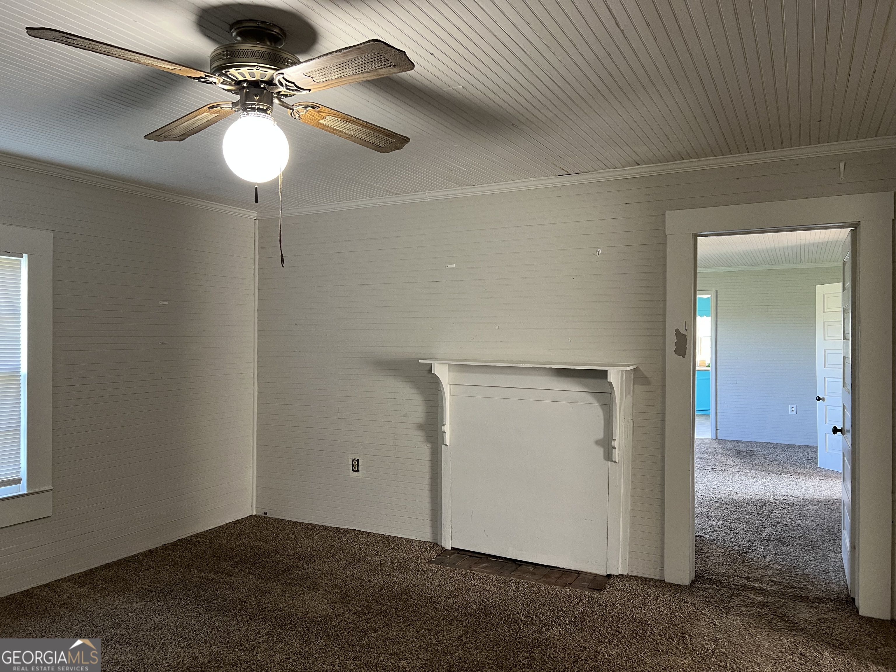 762 Nicholson-Carr Road Chester, GA 31012 - Photo 44 of 80 an empty room with a chandelier fan and windows