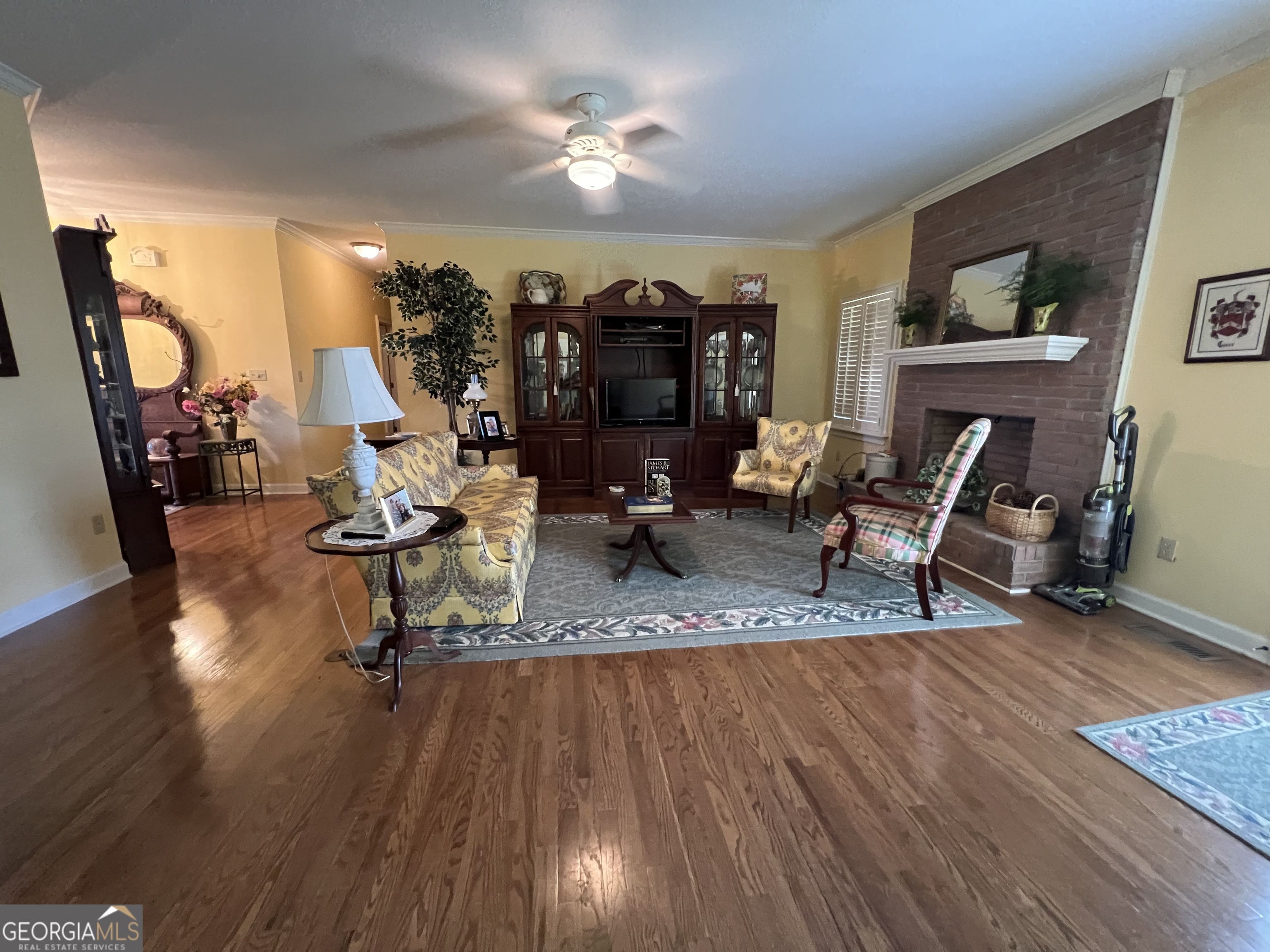 762 Nicholson-Carr Road Chester, GA 31012 - Photo 7 of 80 a living room filled with furniture and a chandelier