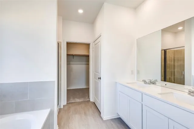 a white bath tub sitting next to a window