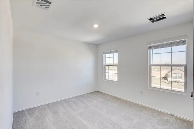 a bathroom with a toilet a sink a mirror a bathtub and vanity