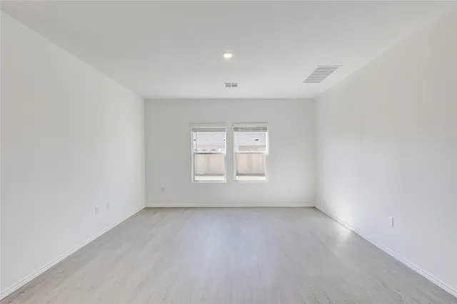 an empty room with a empty space and window