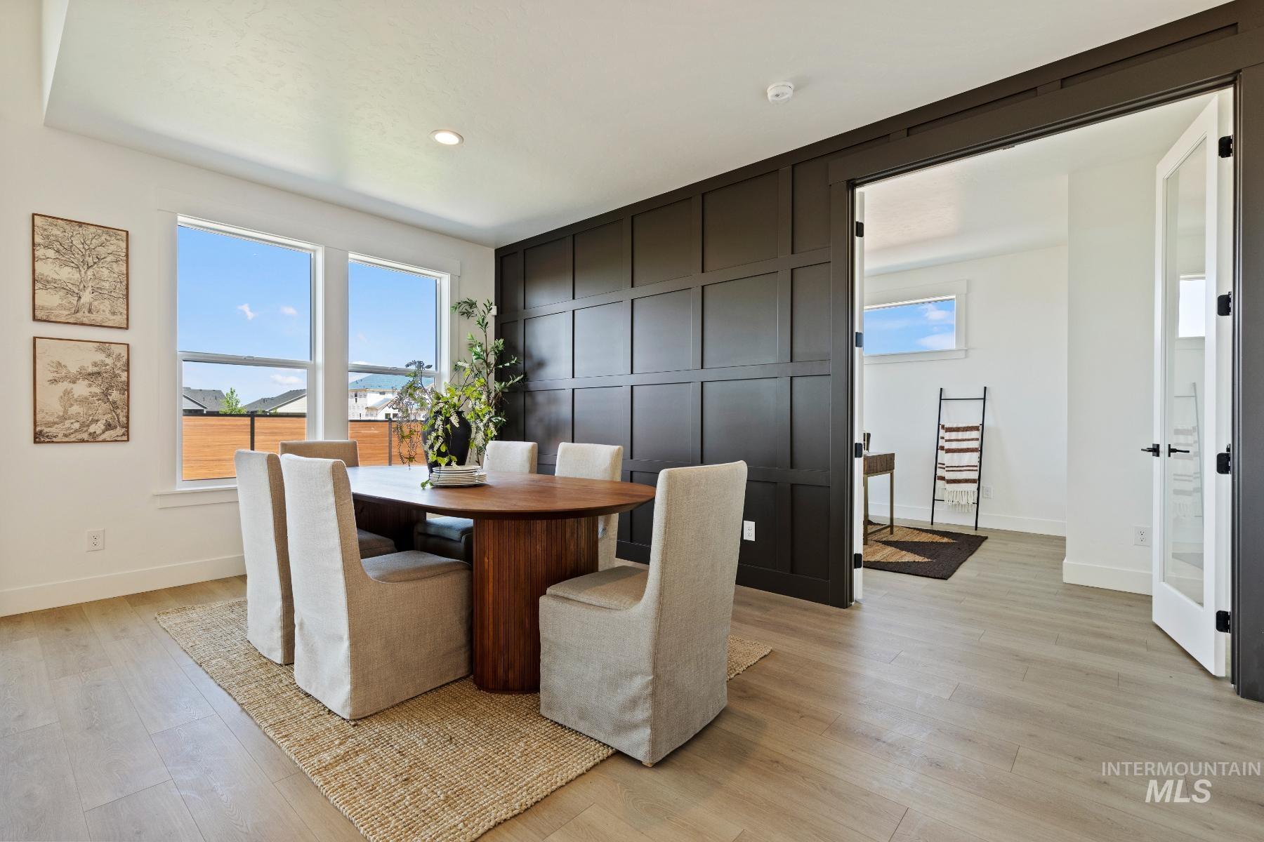8650 West Inspirado Street Meridian, ID 83646 - Photo 12 of 30 Dining area featuring light wood-style flooring and recessed lighting