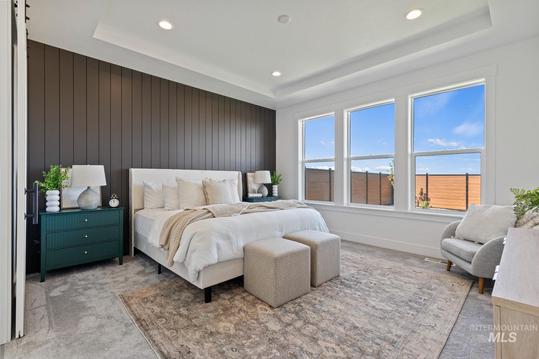 8650 West Inspirado Street Meridian, ID 83646 - Photo 21 of 30 Bedroom with carpet floors, a tray ceiling, recessed lighting, and wood walls