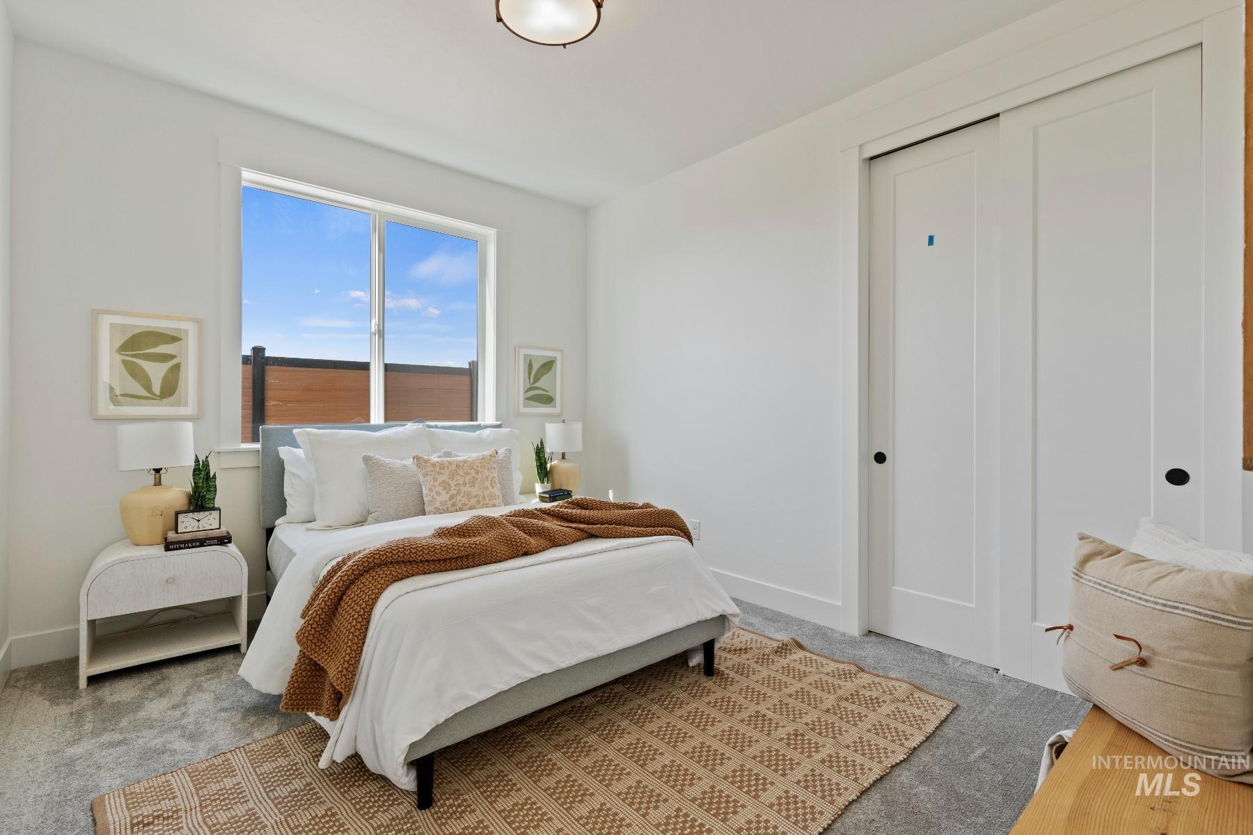 8650 West Inspirado Street Meridian, ID 83646 - Photo 25 of 30 Bedroom with a closet and carpet flooring