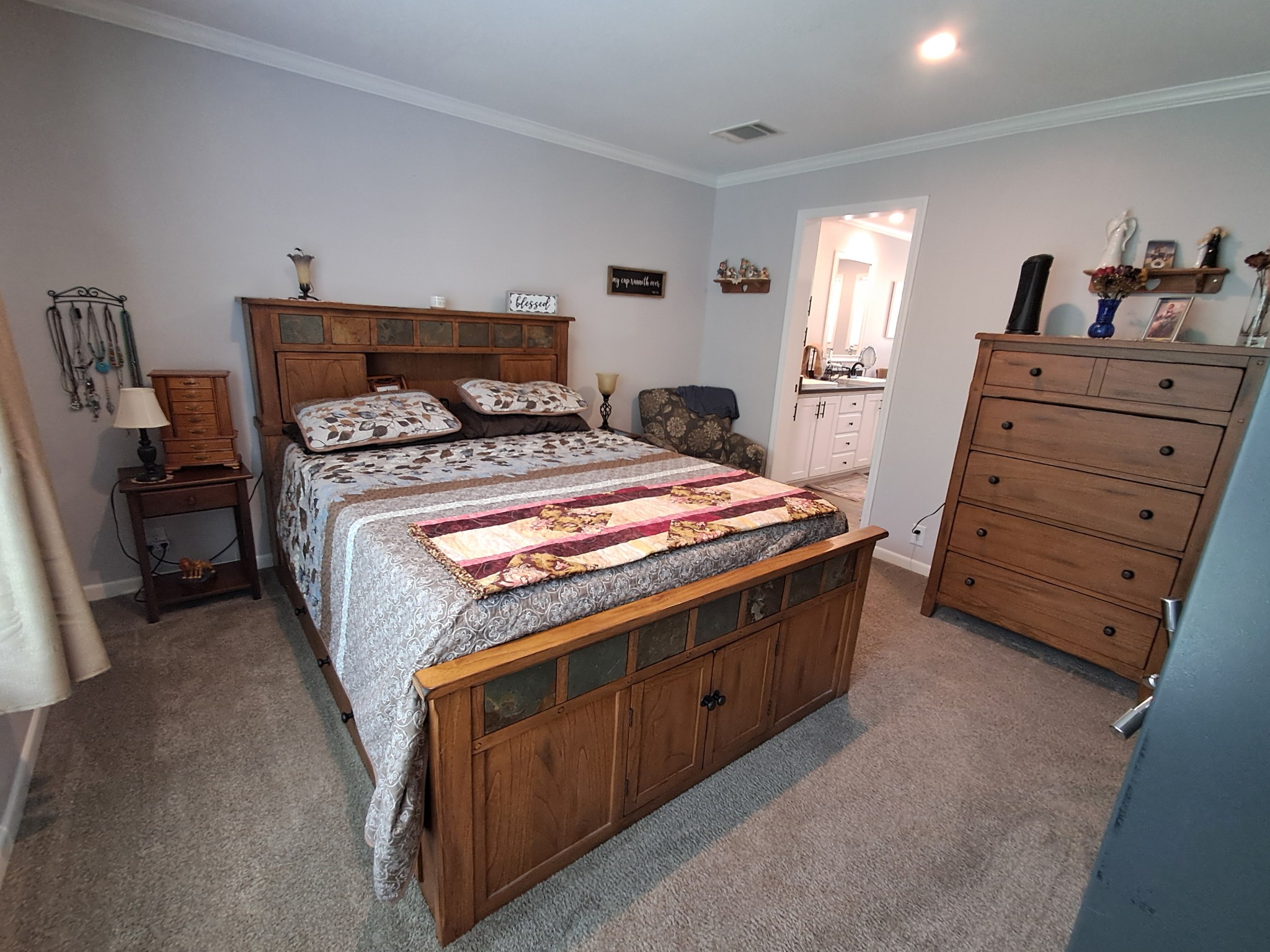 5525 Wiley Hollow Road Culleoka, TN 38451 - Photo 41 of 64 a bed sitting in a bedroom and dresser