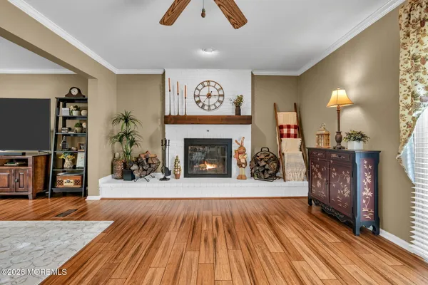 a view of a dining room with furniture window and wooden floor
