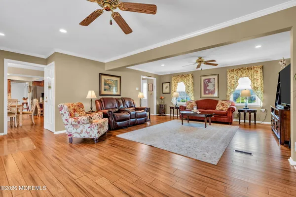 a large kitchen with a table and chairs