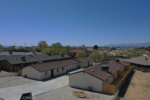 a view of a terrace with couches and sky view