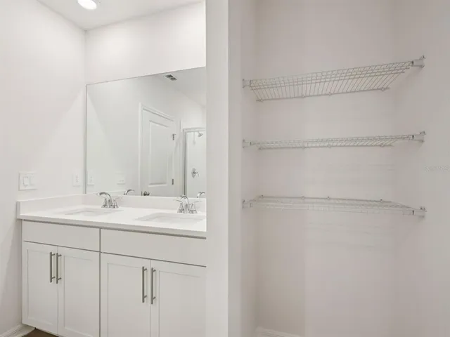 a bathroom with a sink and a mirror