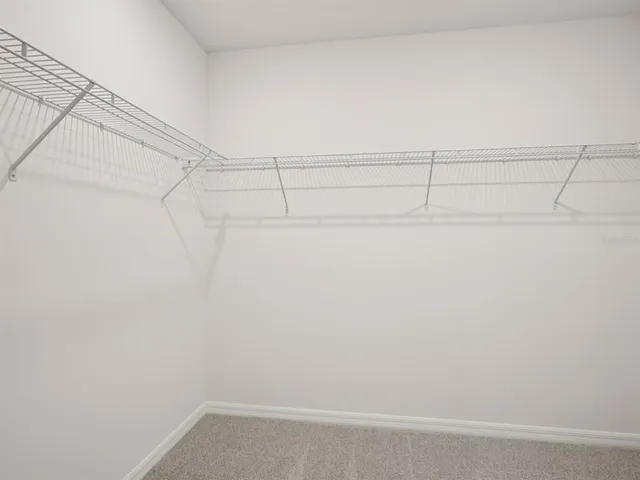 a view of a room with racks on the wall