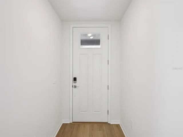 a view of a small space with wooden floor