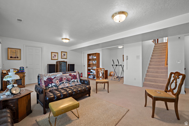 166 South Ridgeview Drive Orem, UT 84058 - Photo 23 of 38 Carpeted flooring, recessed ceiling lighting, and a built-in staircase