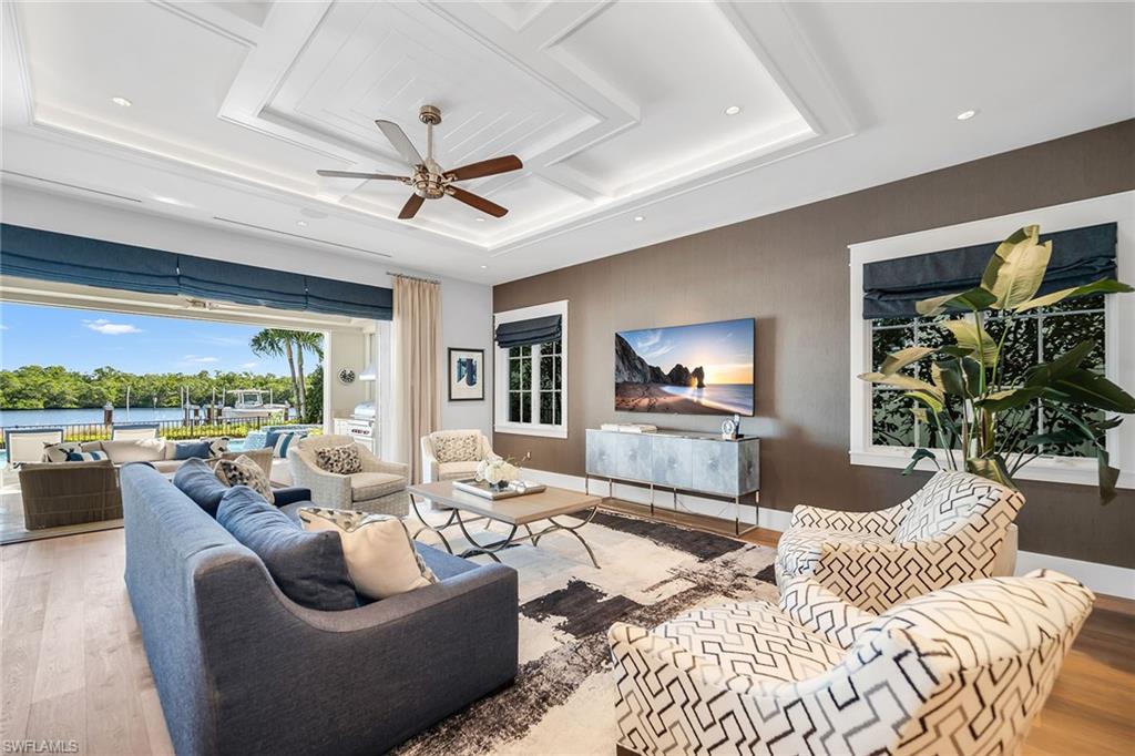 185 15th Street South Naples, FL 34102 - Photo 2 of 49 a living room with furniture and a large window