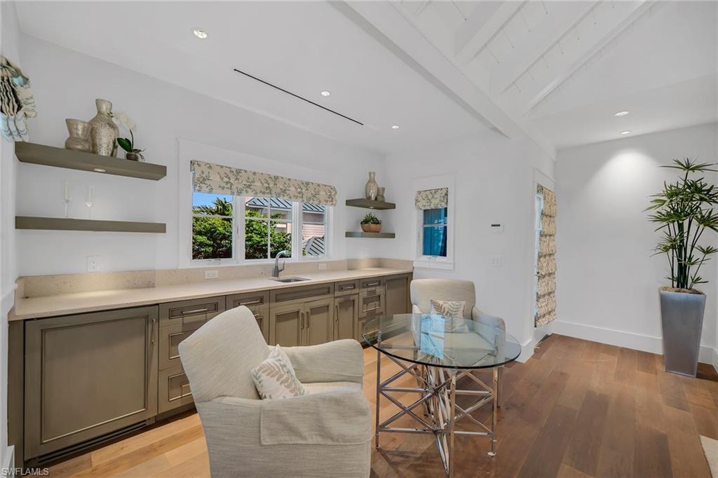 185 15th Street South Naples, FL 34102 - Photo 21 of 49 a kitchen with a table and chairs in it