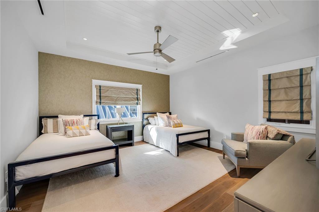 185 15th Street South Naples, FL 34102 - Photo 28 of 49 a bedroom with furniture and a window