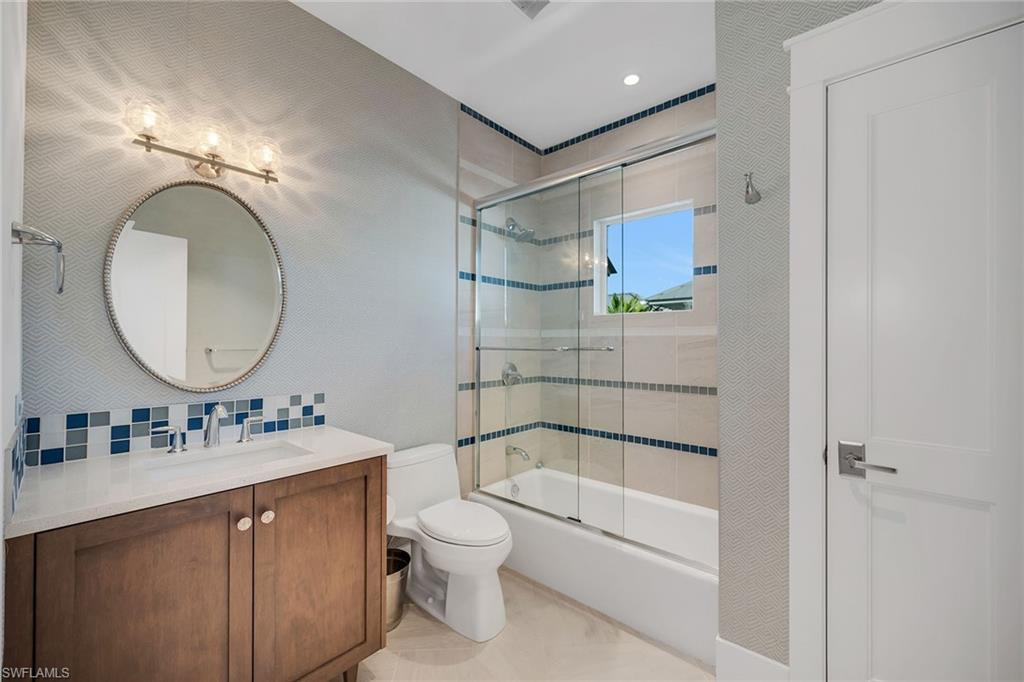 185 15th Street South Naples, FL 34102 - Photo 29 of 49 a bathroom with a sink toilet and shower