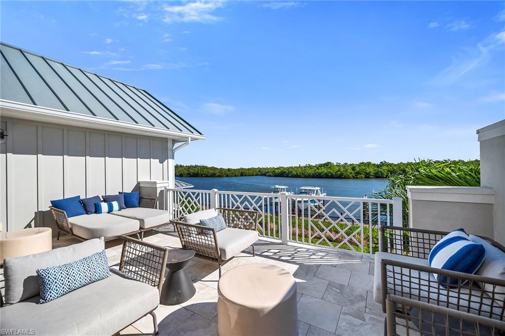 185 15th Street South Naples, FL 34102 - Photo 36 of 49 a patio with patio a couch and chairs