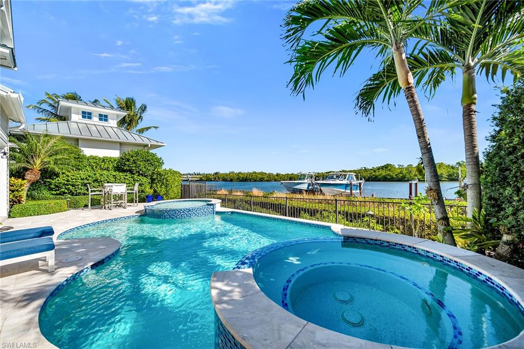 185 15th Street South Naples, FL 34102 - Photo 40 of 49 a view of swimming pool from a balcony