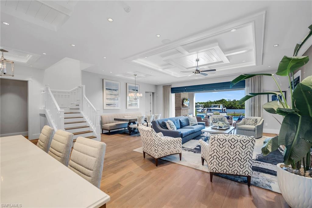185 15th Street South Naples, FL 34102 - Photo 6 of 49 a living room with furniture and wooden floor
