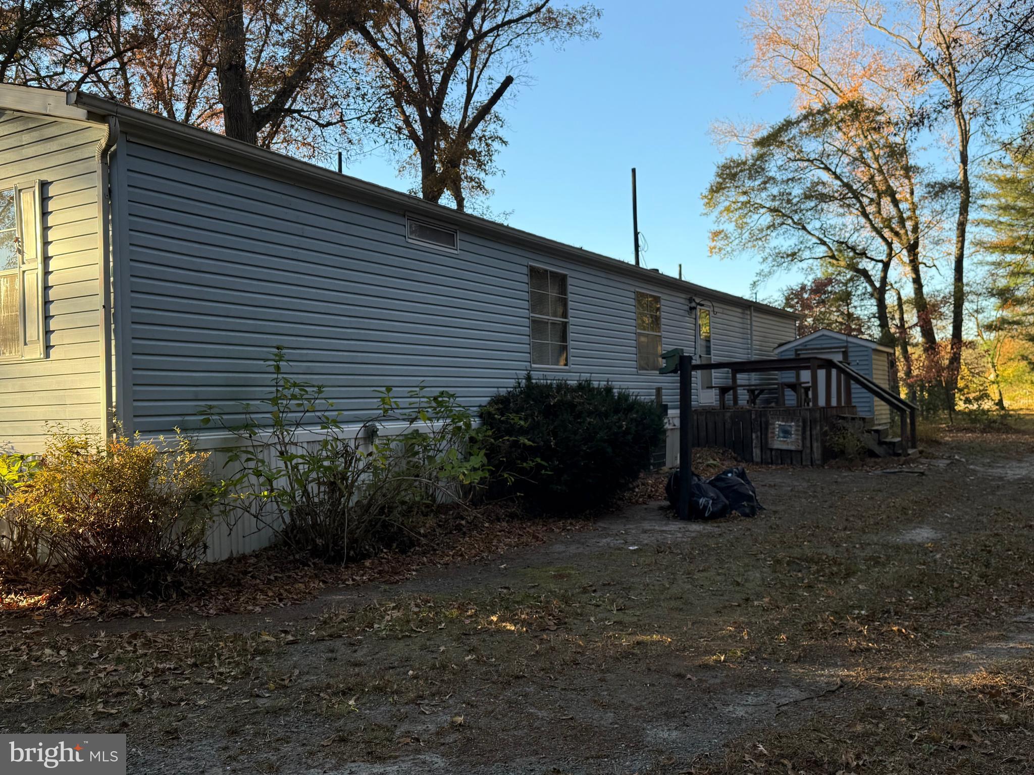 26735 Siloam Road Salisbury, MD 21801 - Photo 2 of 32 Back of home with deck and utility shed