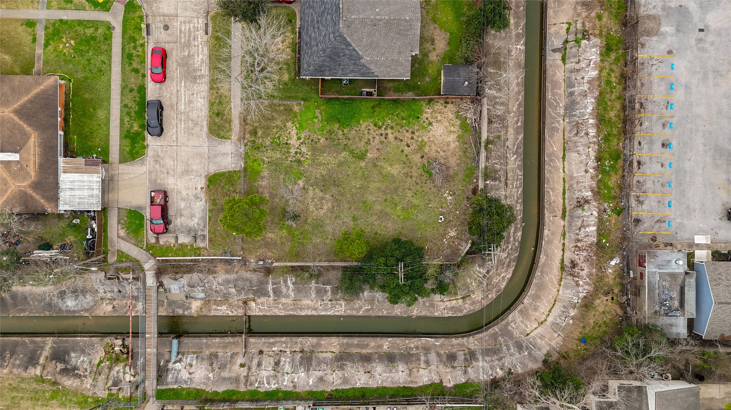 0 Grape Street Houston, TX 77074 - Photo 6 of 9 front view of a house with a fountain and a lake view