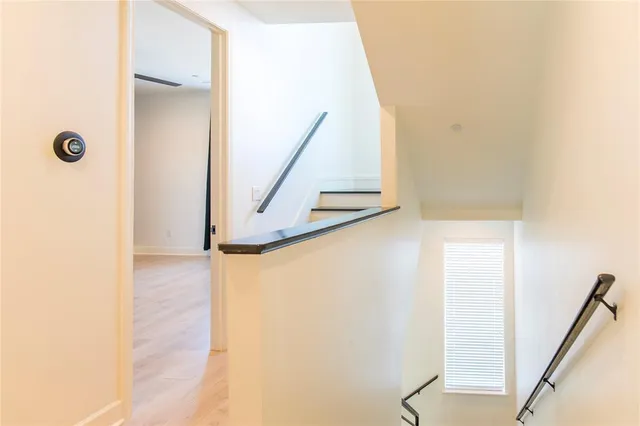a view of a hallway with staircase
